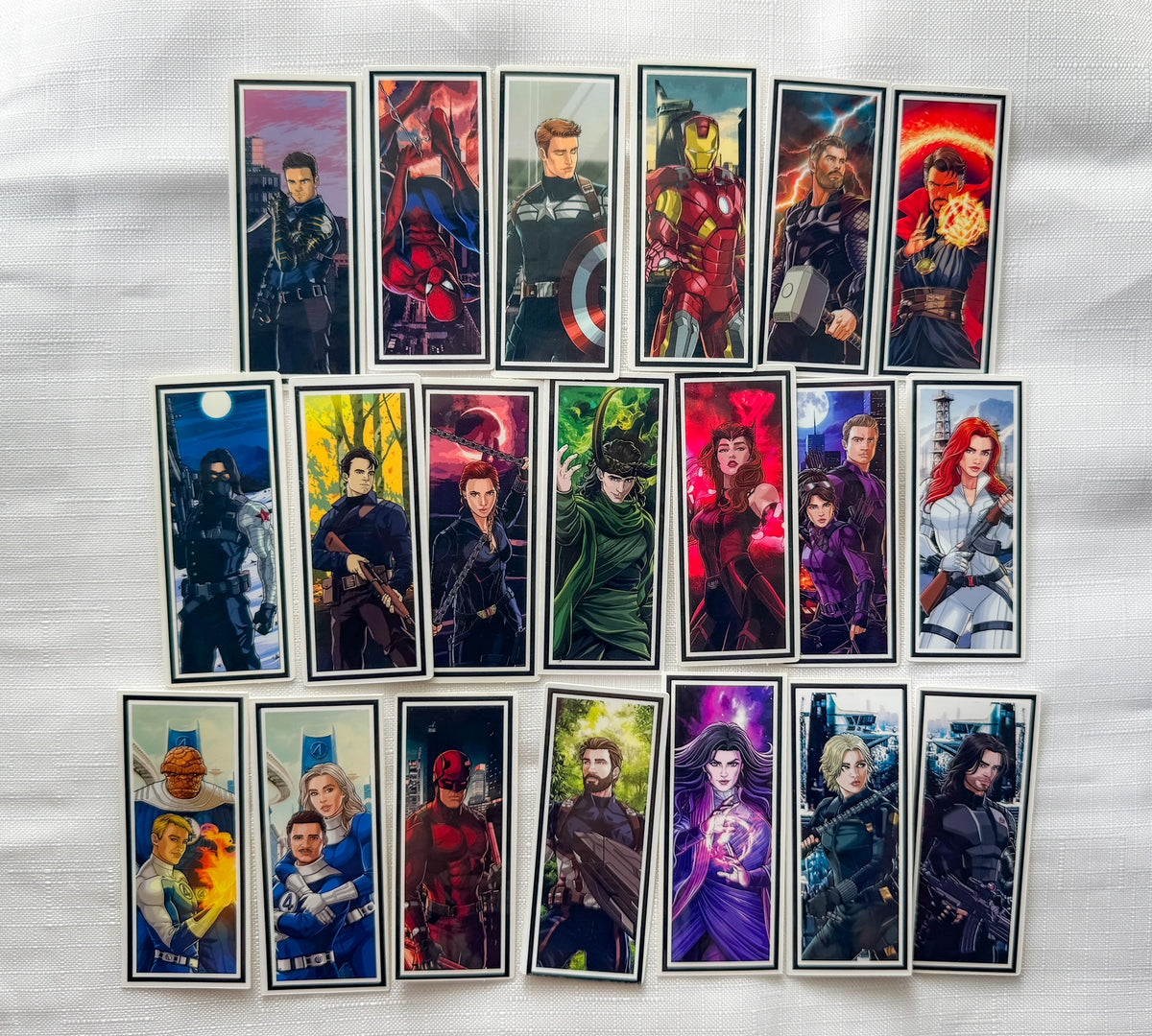 A collection of rectangular stickers showing superheroes in various looks 